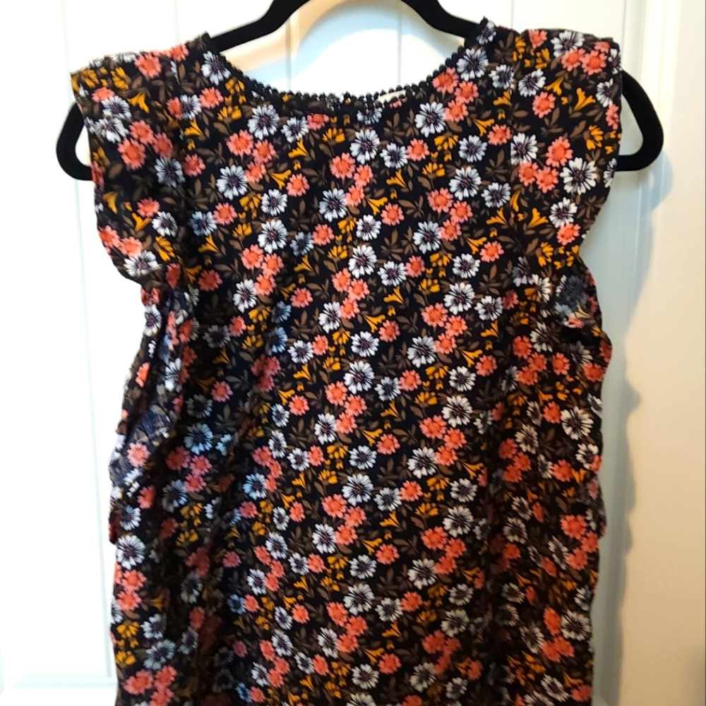 The Loft size Medium floral ruffle cap sleeve top.